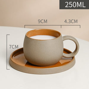 Set of orange cups and saucers