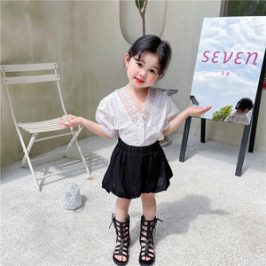 White shirt and black shorts