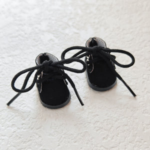 A pair of black Martin boots