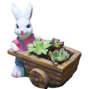 A pair of white rabbit flower pots