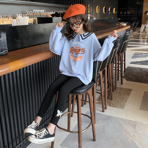 Sky blue sweater and black pan