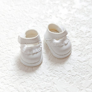 A pair of lace white leather shoes