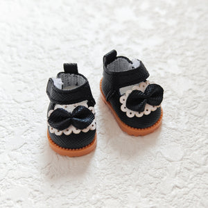 A pair of Black Princess shoes