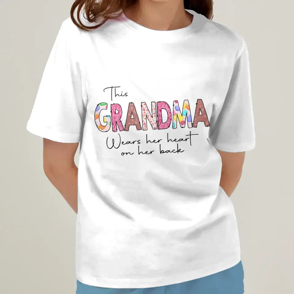 Personalized Grandma AOP T-Shirt - Up to 6 Kids - Mother's Day Gift Idea For Grandma - This Grandma Wears Her Heart On Her Back