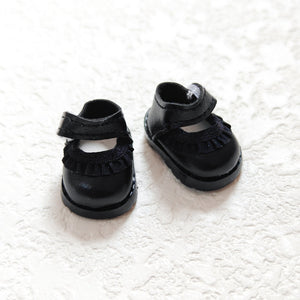 A pair of lace black leather shoes