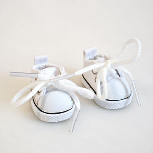 A pair of white canvas shoes