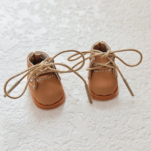 A pair of brown Martin boots