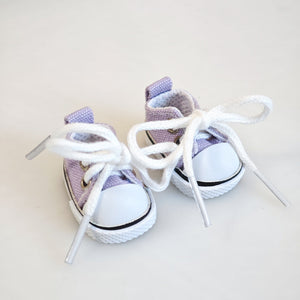 A pair of purple canvas shoes