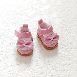 A pair of pink princess shoes