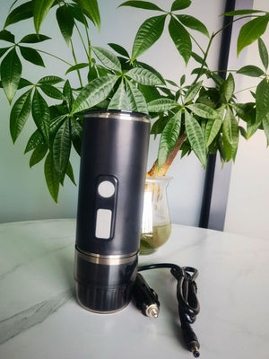 Black capsule coffee machine with heating